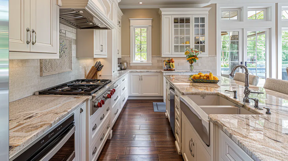 a modern kitchen with white cabinets