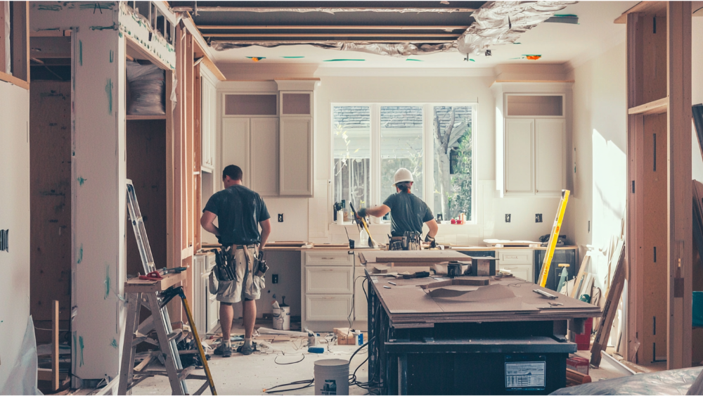 Two men remodeling a kitchen