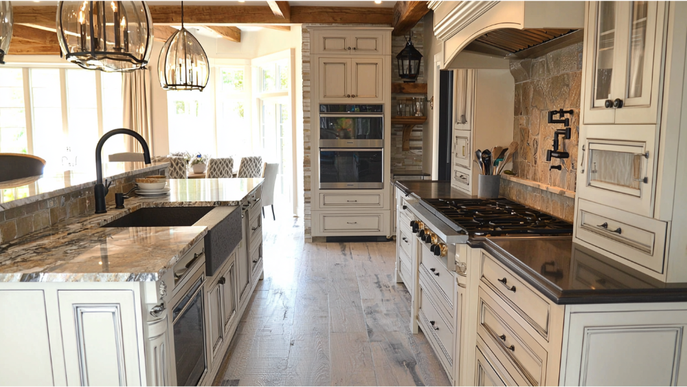 A remodeled kitchen with a black kitchen facuet